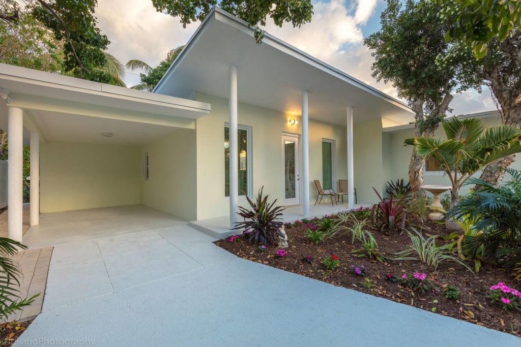Automatic Gate Front Entry-to One car Carport. Driveway holds 2 cars.