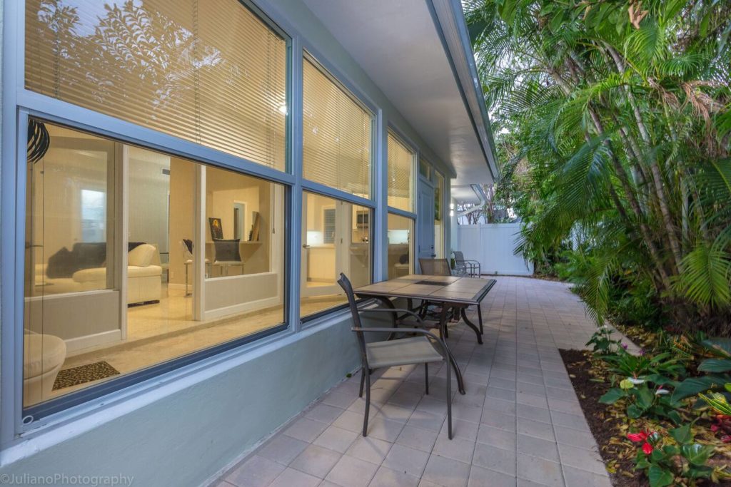 Outside dining area in back. Privacy fence around entire house.