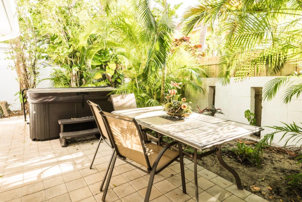 Outside dining area in back. Privacy fence around entire house.