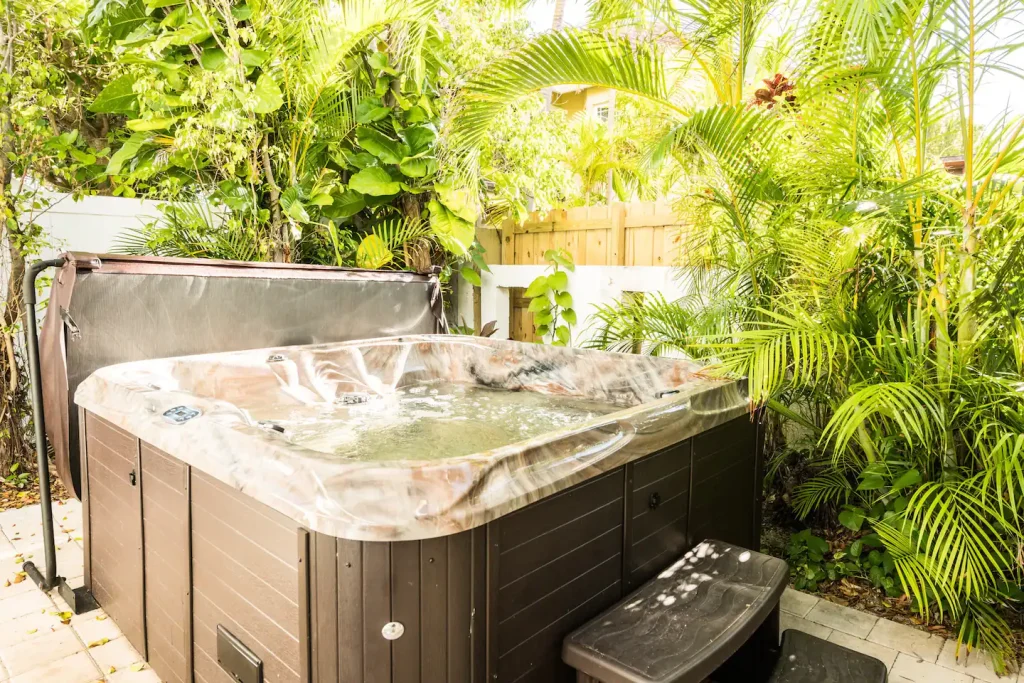 Hot Tub has cover lifter, 2 speed pumps, 30 jets, steps, and lights.