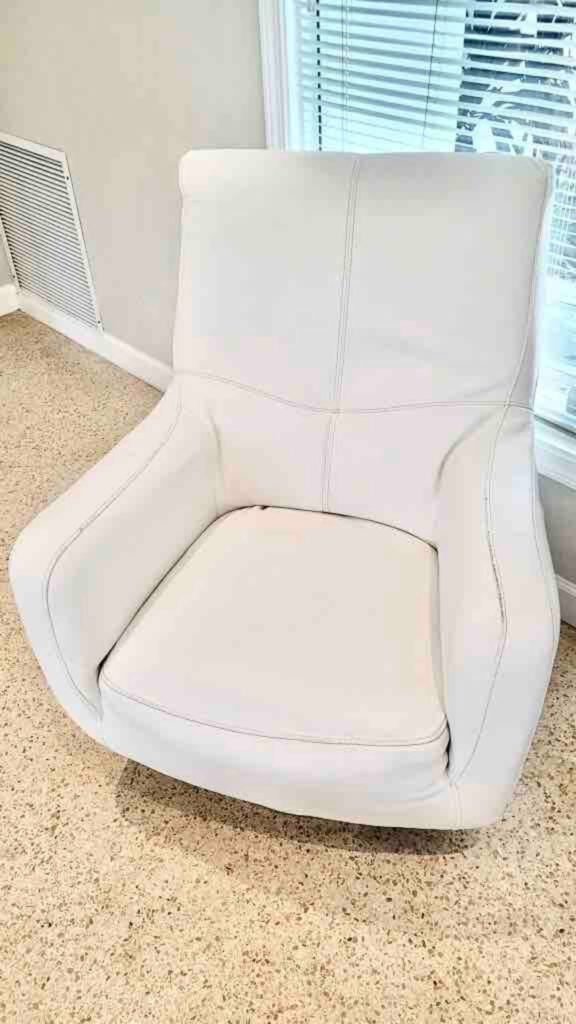 Swivel leather lounger in family room.