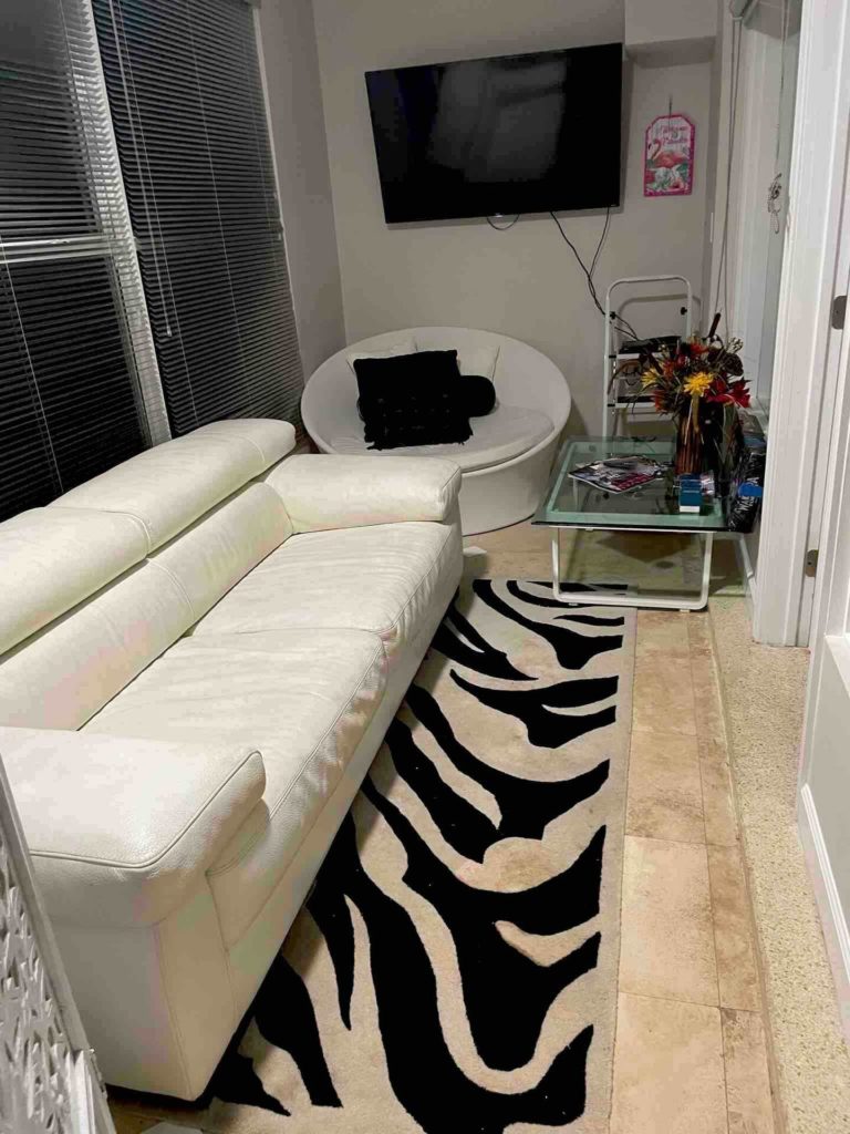 Added this leather sofa that was in living room to the Florida room. Another white leather sofa was added to the living room. Black futon was moved into living room for more family seating.