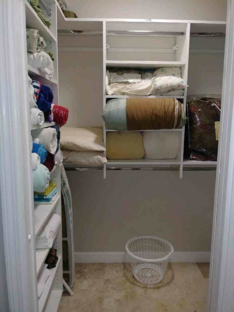 Walk-in Master closet across from Laundry room