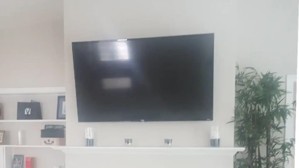 Living Room - view of 55" 4K Roku Smart TV installed over Fireplace.